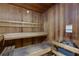 The sauna has wooden benches, wood-paneled walls, and heater for a relaxing and detoxifying experience at 3040 Peachtree Nw Rd # 511, Atlanta, GA 30305
