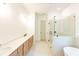 Bright primary bath with double vanity, walk-in shower, and free standing tub at 6565 Rhett Run, Cumming, GA 30028