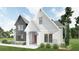 Stunning two-story house with white siding, modern windows, and well-maintained landscaping at 6565 Rhett Run, Cumming, GA 30028