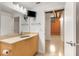Bathroom featuring a television, and a neutral-toned vanity with a large mirror and modern fixtures at 170 Boulevard Se # E006, Atlanta, GA 30312
