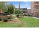 Well maintained grass courtyard surrounded by beautiful landscaping, plants, and manicured trees at 170 Boulevard Se # E006, Atlanta, GA 30312