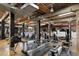Spacious gym with high ceilings, exposed wood beams, and modern fitness equipment at 170 Boulevard Se # E006, Atlanta, GA 30312