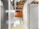 Hallway leading to unit featuring exposed ceilings, leading to modern and comfortable living space at 170 Boulevard Se # E006, Atlanta, GA 30312