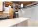 Open kitchen with stainless steel appliances, quartz countertops, island and exposed wooden ceiling beams at 170 Boulevard Se # E006, Atlanta, GA 30312