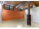 Bright living room with exposed brick wall, windows, and ceiling beams in a modern home at 170 Boulevard Se # E006, Atlanta, GA 30312