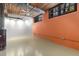 Bright living room with an exposed brick wall, industrial ceiling, and light-colored floors at 170 Boulevard Se # E006, Atlanta, GA 30312