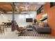 Bright living space with exposed brick, wooden ceiling, and comfortable seating, creating an inviting atmosphere at 170 Boulevard Se # E006, Atlanta, GA 30312