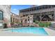 Community pool with lounge chairs surrounded by an old brick industrial building at 170 Boulevard Se # E006, Atlanta, GA 30312