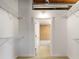 Walk-in closet featuring white walls, shelving, and a doorway to an adjacent bathroom at 170 Boulevard Se # E006, Atlanta, GA 30312