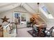 Cozy attic room with skylights, built-in desk, and comfortable seating area at 218 Barry St, Decatur, GA 30030
