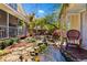 Picturesque backyard with a stream, landscaped features, and inviting seating areas at 218 Barry St, Decatur, GA 30030