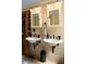 Renovated bathroom featuring double sink vanity with updated lighting and fixtures at 218 Barry St, Decatur, GA 30030