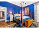 Spacious bedroom with hardwood floors, a four-poster bed and en suite bathroom at 218 Barry St, Decatur, GA 30030