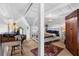 Split view of bright attic bedroom with desk and bedroom with large windows at 218 Barry St, Decatur, GA 30030