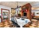Dining area with checkered floors, a brick fireplace, and views into the living room at 218 Barry St, Decatur, GA 30030