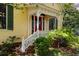 Inviting entrance with red door, white porch, and lush landscaping at 218 Barry St, Decatur, GA 30030