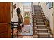 Inviting entryway with stained glass door, staircase, and ample natural light at 218 Barry St, Decatur, GA 30030