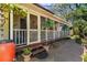 Charming home exterior with screened porch, brick patio, and well-maintained landscaping at 218 Barry St, Decatur, GA 30030