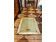 Unique, vintage trap door blends seamlessly into the home's rustic, patterned wood flooring at 218 Barry St, Decatur, GA 30030