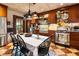 Charming kitchen with wooden cabinets, stainless steel appliances, and an adjacent dining area at 218 Barry St, Decatur, GA 30030