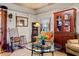 Cozy living room with vintage furnishings, including a rocking chair and glass coffee table at 218 Barry St, Decatur, GA 30030