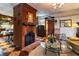 Charming living room with a brick fireplace, decorative furnishings, and an open floor plan at 218 Barry St, Decatur, GA 30030