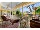 Inviting screened porch with swing, ceiling fan and lush greenery views at 218 Barry St, Decatur, GA 30030
