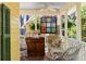 Relaxing screened porch featuring wicker furniture and charming vintage decor at 218 Barry St, Decatur, GA 30030