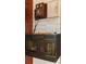 Vintage decor featuring a wooden phone and cabinet mounted on a white shiplap wall at 218 Barry St, Decatur, GA 30030