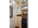 Compact wet bar with wooden shelves, a wine fridge, and rustic decor, perfect for entertaining at 218 Barry St, Decatur, GA 30030