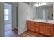 Bright bathroom featuring a double vanity with wood cabinets and modern lighting at 2241 Nottley Dr # 4, Marietta, GA 30066