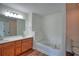 Bright bathroom with a double sink vanity, white countertops, and a soaking tub at 2241 Nottley Dr # 4, Marietta, GA 30066