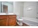 Bright bathroom featuring a shower-tub, wooden cabinets, and a large mirror at 2241 Nottley Dr # 4, Marietta, GA 30066