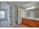 Bathroom featuring a double vanity, wood cabinets, and a shower and tub area at 2241 Nottley Dr # 4, Marietta, GA 30066