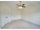 Empty bedroom with neutral walls, carpet, ceiling fan and a pair of bi-fold doors at 2241 Nottley Dr # 4, Marietta, GA 30066