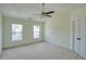 The walls are empty and neutral, and the floor is carpeted. Two windows allow for bright, natural light at 2241 Nottley Dr # 4, Marietta, GA 30066