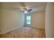 Bedroom with neutral carpet, a ceiling fan, and a large window at 2241 Nottley Dr # 4, Marietta, GA 30066