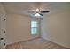 Bedroom with neutral carpet, a window with nature views, and a closet at 2241 Nottley Dr # 4, Marietta, GA 30066