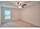 Bedroom with neutral carpet, ceiling fan, and natural light from a window at 2241 Nottley Dr # 4, Marietta, GA 30066