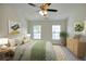 Bright bedroom with neutral walls, carpet, ceiling fan and natural light from two windows with decor at 2241 Nottley Dr # 4, Marietta, GA 30066