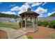 Beautiful wooden gazebo with a seat inside, perfect for relaxing in a communal area at 2241 Nottley Dr # 4, Marietta, GA 30066