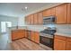 Open concept kitchen with stainless steel appliances, modern cabinets, and eat-in bar at 2241 Nottley Dr # 4, Marietta, GA 30066