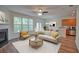 Bright living room featuring a fireplace, ceiling fan, and view of the outdoors at 2241 Nottley Dr # 4, Marietta, GA 30066