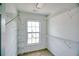 Walk-in closet with carpet, a window for natural light, and wire shelving units at 2241 Nottley Dr # 4, Marietta, GA 30066