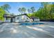 Expansive backyard features a private swimming pool and lush greenery, perfect for outdoor enjoyment at 295 Hollyberry Dr, Roswell, GA 30076