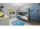 bedroom features playful dinosaur-themed decor, including a bunk bed and a blue dinosaur rug at 295 Hollyberry Dr, Roswell, GA 30076