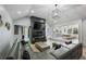 Stylish living area with modern fireplace, open floor plan and seamless flow to the kitchen and dining area at 295 Hollyberry Dr, Roswell, GA 30076