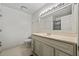 Bathroom features a large vanity with a sink, a toilet, and a shower with white tiling at 3188 Paces Mill Se Rd, Atlanta, GA 30339
