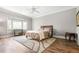 A serene bedroom features a plush bed with wooden floors and a bright window at 3188 Paces Mill Se Rd, Atlanta, GA 30339