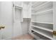 This walk in closet is fully equipped with shelves and racks at 3188 Paces Mill Se Rd, Atlanta, GA 30339